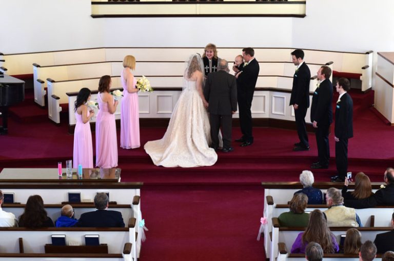 wedding party standing at the front of university congregational church