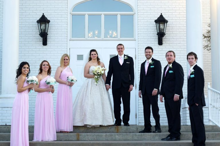 wedding party smiling on the front steps of university congregational church